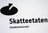 Skatteetatens logo og teksten Skatteetaten Skattedirektoratet på vegg ved Helsfyr i Oslo